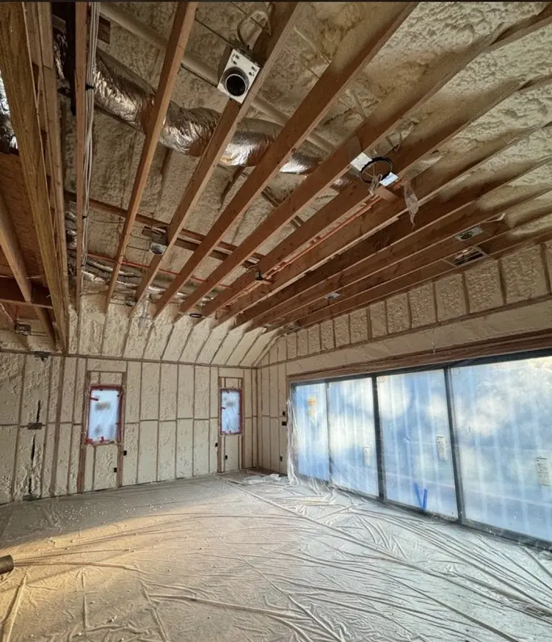Interior walls and ceiling insulated with spray foam during new construction in Binghamton